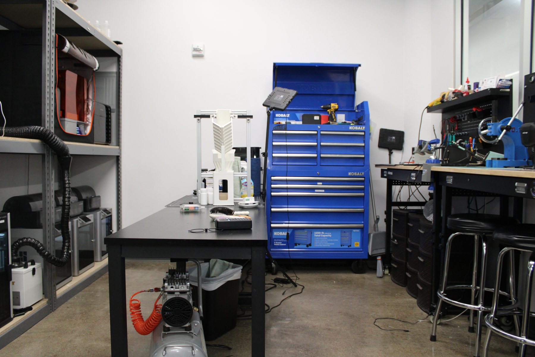 Lab workbench, tool chest and engineering stations in the Flores Engineering lab