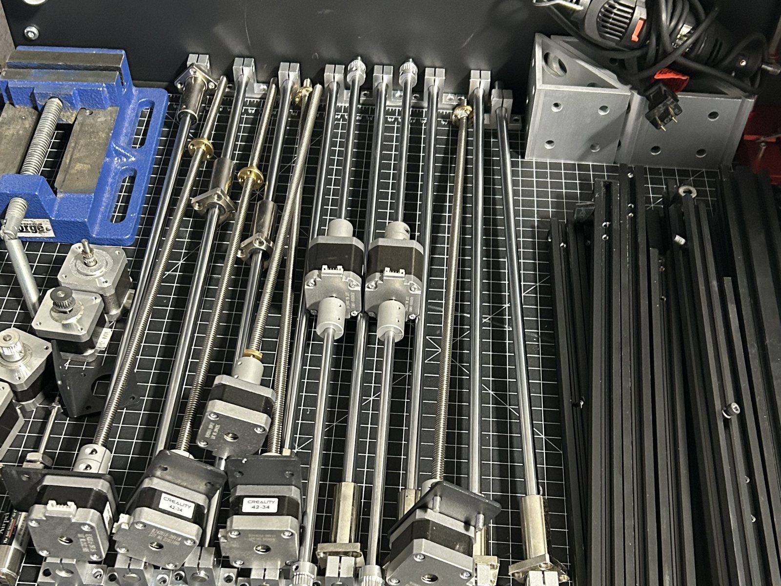 Stepper motors, lead screws and linear actuators laid out in the Flores Engineering lab