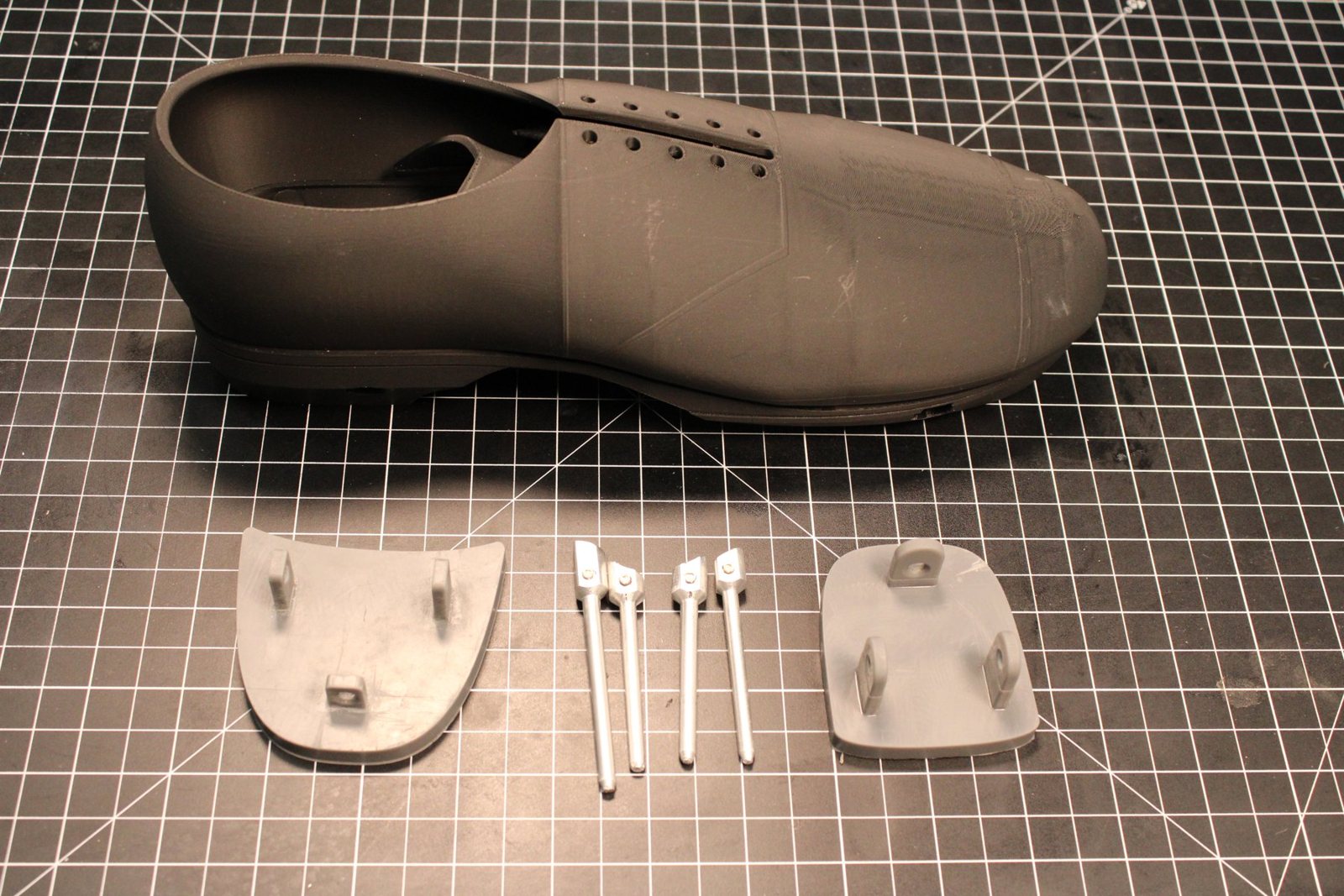 Printed tap shoe with heel and toe plates and machined pins